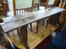 A PAIR OF LONG WOODEN BENCHES