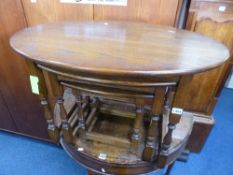 AN 'OLD CHARM' OAK OVAL NEST OF THREE TABLES