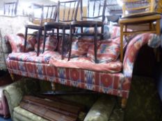 AN UPHOLSTERED THREE SEATER SETTEE