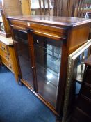A MODERN MAHOGANY GLAZED TWO DOOR DISPLAY CABINET (key)