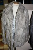 A GREY CONEY FUR JACKET