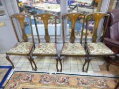 A SET OF FOUR WALNUT INLAID DINING CHAIRS