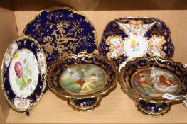 A PAIR OF VIENNA STYLE PORCELAIN COMPORTS, scalloped edged with hand painted circular panel,