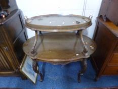 AN EARLY 20TH CENTURY MAHOGANY OVAL TWO TIER TRAY TOP BUFFET, with carved cabriole supports,