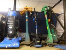 A VAX UPRIGHT VACUUM CLEANER, an electric garden blower/vacuum and four garden strimmers (6)