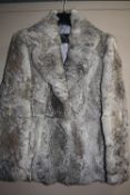 A GREY FUR JACKET, size 14m 'Infurs' label