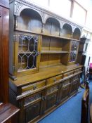 AN 'OLD CHARM' CARVED OAK LEAD GLAZED DRESSER, approximate size width 188cm x depth 44cm x height