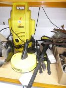A KARCHER PRESSURE WASHER, with accessories
