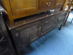A CARVED OAK SIDEBOARD