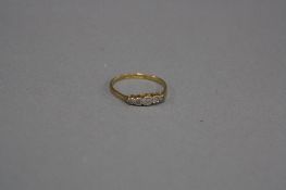 AN EARLY 20TH CENTURY FIVE STONE DIAMOND HALF HOOP RING, estimated total eight cut diamond weight