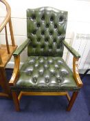 A GREEN LEATHER BUTTONED 'GAINSBOROUGH' STYLE CHAIR, with mahogany frame