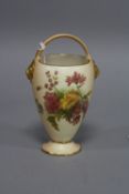 A SMALL ROYAL WORCESTER BLUSH IVORY BASKET, florally decorated, green factory mark, height