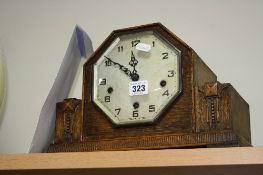 AN OAK CASED MANTLE CLOCK, (key and pendulum)