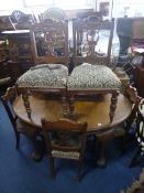 AN OVAL OAK WIND OUT DINING TABLE, with heavy ball and claw supports, one extra leaf, approximate