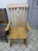 A MODERN SLAT BACK ROCKING CHAIR, with pierced central splat