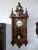 A VICTORIAN WALNUT CASED WALL CLOCK, face marked 'G B' for Gustav Becker