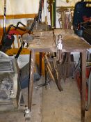 THREE VICES ON A METAL STAND, and a quantity of garden tools