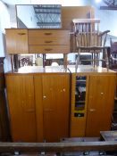 A TEAK THREE PIECE BEDROOM SUITE, comprising two wardrobes and a dressing table