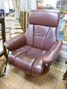 A BROWN LEATHER UPHOLSTERED RECLINING SWIVEL CHAIR (sd)