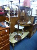 A MODERN WALNUT CIRCULAR OCCASIONAL TABLE, another table, nest of three tables, two standard