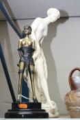 A REPRODUCTION CAST METAL ART DECO STYLE FIGURE OF A SCANTILY CLAD LADY, and plaster figure of a