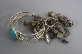 A SILVER CHARM BRACELET, and a turquoise bracelet (2)