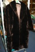 A LONG FAUX FUR COAT, with 'Moulton Processors Ltd' label