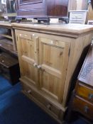 A PINE TWO DOOR CABINET, above a single drawer