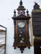 A VICTORIAN WALNUT CASED WALL CLOCK, (key and pendulum)