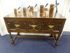 A SMALL GEORGIAN AND LATER OAK THREE DRAWER DRESSER BASE, the drawers with geometric detail,