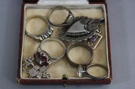 A MIXED LOT OF SILVER ITEMS, including fobs, rings, pendants, etc