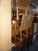 A QUANTITY OF VARIOUS TEAK FURNITURE, to include two extending dining tables and eight chairs (one