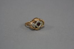 A LATE 20TH CENTURY SINGLE STONE GARNET RING, fancy engraved and open work design, ring size N,