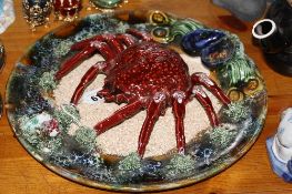 A PALISSY STYLE PLAQUE, modelled with a crab and mussels, diameter approximately 33cm