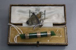 A JADE AND GOLD BAR BROOCH, and a silver Butterfly (2)