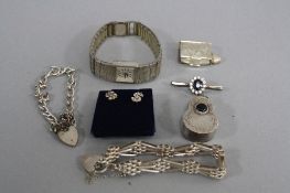 A MIXED LOT OF SILVER, including watch, bracelet, novelty charms, etc