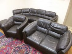 A LARGE BROWN LEATHER CORNER SUITE