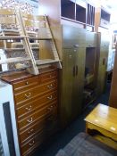 A THREE PIECE BEDROOM FITMENT, and a tall chest of two short and five long drawers (2)