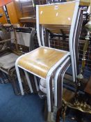 SIX TUBULAR METAL STACKING CHAIRS, with plywood seats and backrests (sd)
