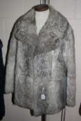 A GREY FUR JACKET, size 14