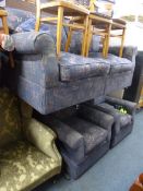 AN UPHOLSTERED BLUE THREE PIECE SUITE, comprising of a two seater bed/settee and a pair of armchair