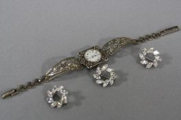 A SILVER MARCASITE WATCH, and three silver brooches (4)