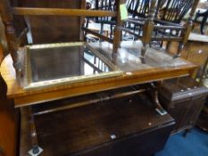 A LARGE MAHOGANY COFFEE TABLE, with leather inset top, table lamp with shade and a gilt framed