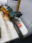 A MAKITA ELECTRIC CHAINSAW, and accessories