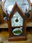 AN AMERICAN MANTLE CLOCK, 'Seth Thomas' label to inside and a wall mirror (key and pendulum) (sd) (