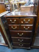 A MODERN HARDWOOD CHEST, of five drawers and a gilt framed wall mirror (2)