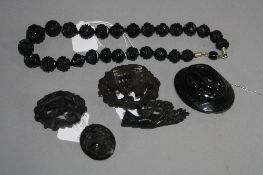 A COLLECTION OF JET JEWELLERY, to include a carved bead necklace, round carved beads graduating in