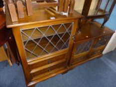 AN OAK GLAZED TV STAND, a matching hi-fi cabinet, etc (sd) (3)