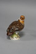 A MEISSEN FIGURE, of an English Partridge on a circular base, incised '428' and impressed 101,