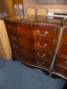 A MODERN MAHOGANY CHEST, of four long drawers with serpentine front (s.d.)